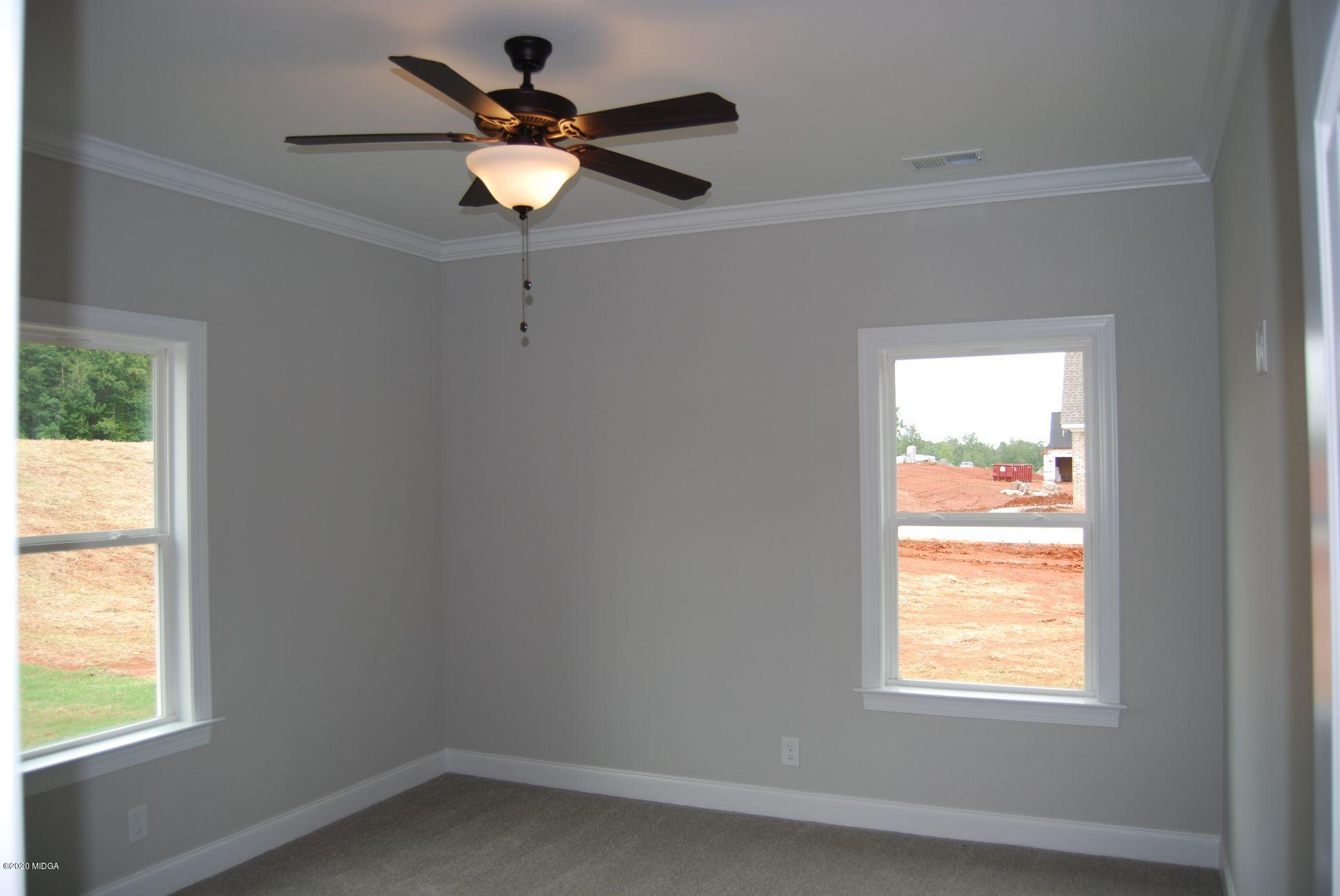 65 Carters Way Forsyth, GA 31029 - Photo 8 of 13 a window in an empty room