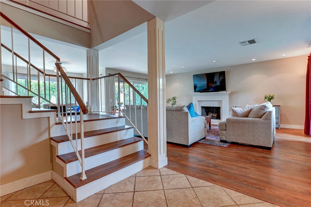 19238 Castlebay Lane Porter Ranch, CA 91326 - Photo 3 of 38 a living room with furniture and a fireplace