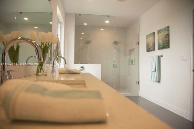 15105 Southwest 180th Street Miami, FL 33187 - Photo 12 of 21 a bathroom with a sink and mirror
