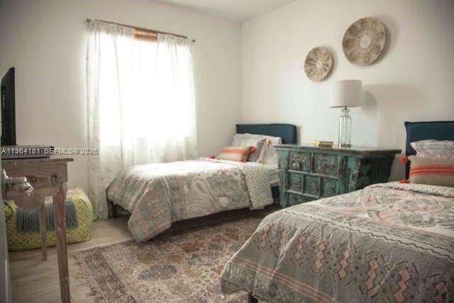15105 Southwest 180th Street Miami, FL 33187 - Photo 15 of 21 a bedroom with two bed and a large window
