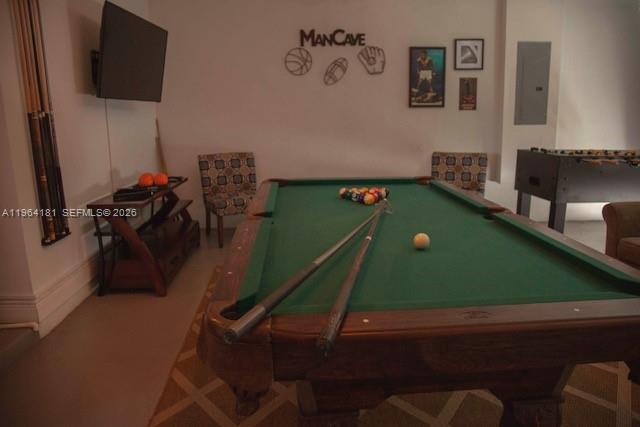 15105 Southwest 180th Street Miami, FL 33187 - Photo 17 of 21 a room with games and windows