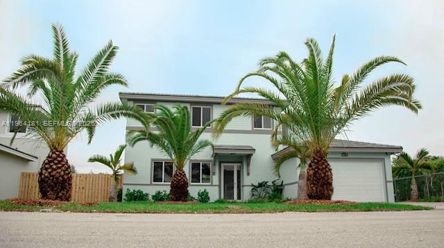 15105 Southwest 180th Street Miami, FL 33187 - Photo 20 of 21 a front view of multiple houses with yard