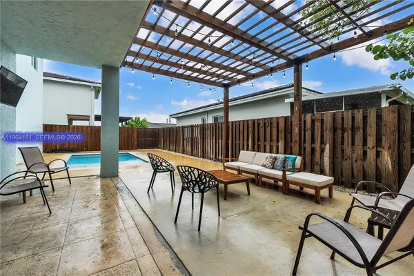 a view of a chairs and tables in patio