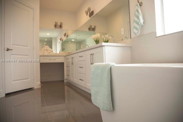 15105 Southwest 180th Street Miami, FL 33187 - Photo 9 of 21 a bathroom with a double vanity sink and a mirror