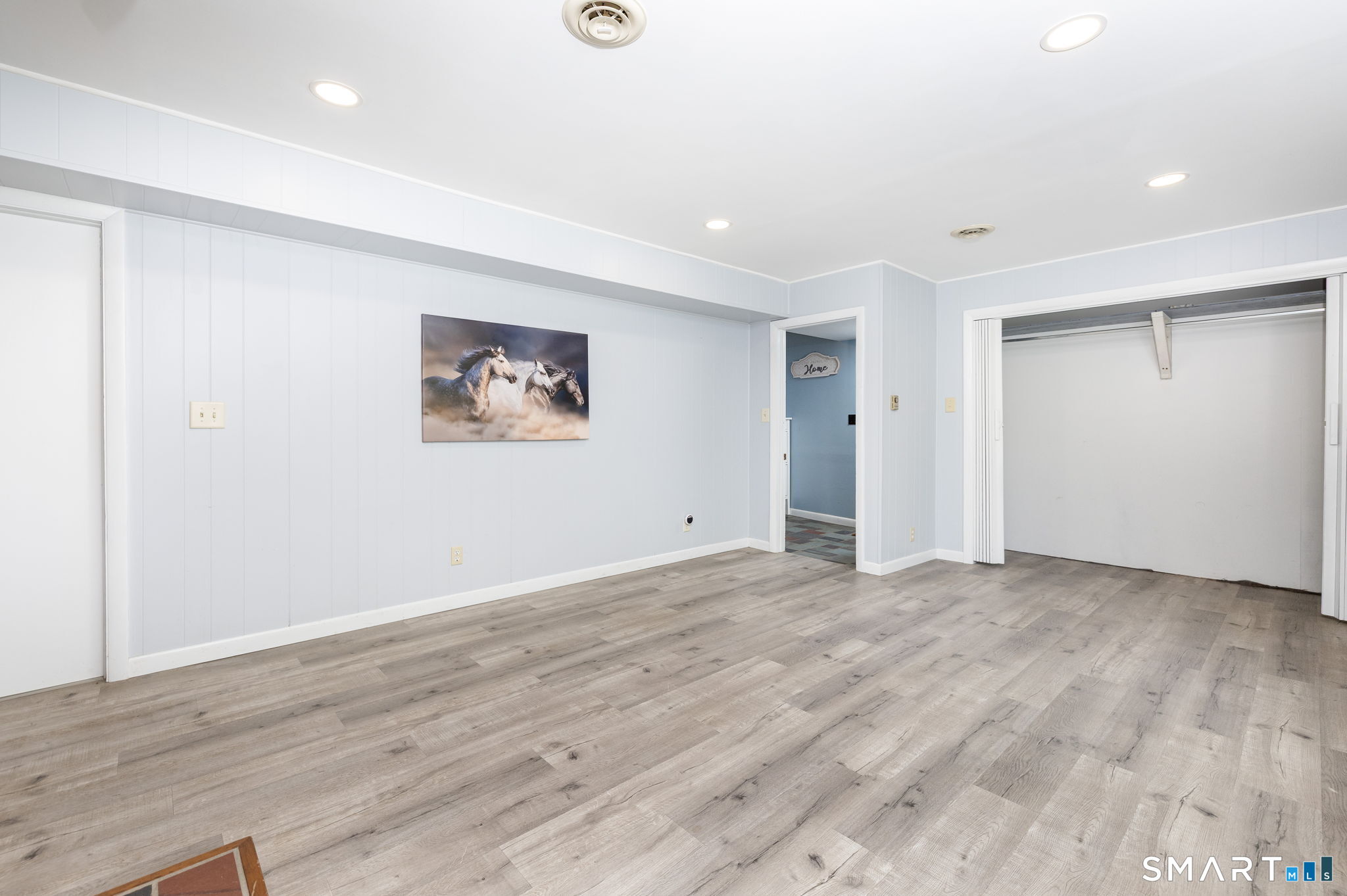 250 Center Hill Road Barkhamsted, CT 06063 - Photo 22 of 40 an empty room with wooden floor and window