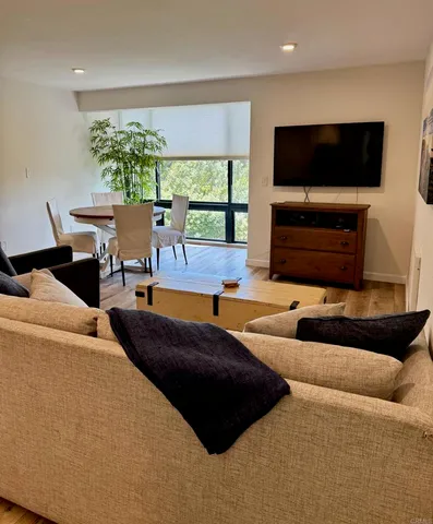 a living room with fireplace furniture and a flat screen tv
