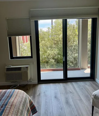 a view of front door with wooden floor
