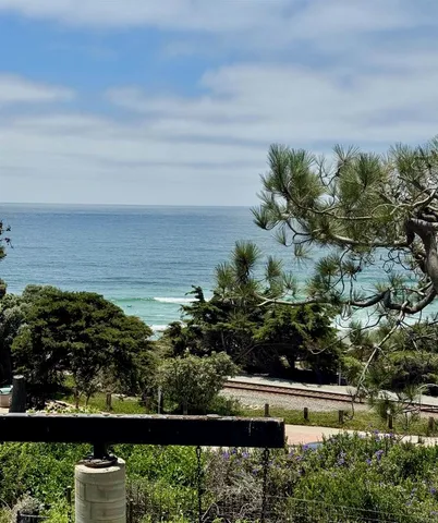 a view of a lake with a floor to ceiling window
