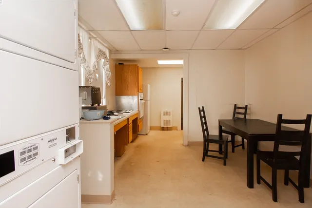 a kitchen that has a table and chairs in it