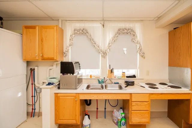 a kitchen with a sink and a window
