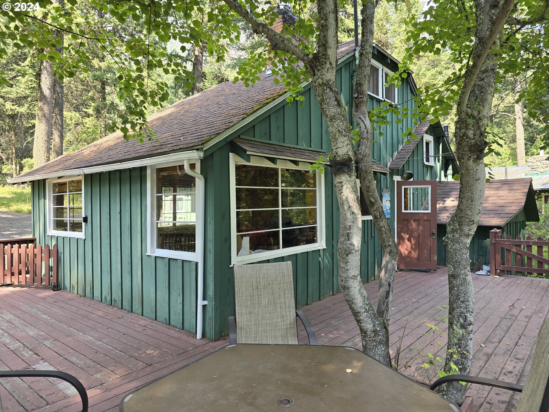59975 Pollock Road Joseph, OR 97846 - Photo 21 of 34 a front view of a house with a yard and garage