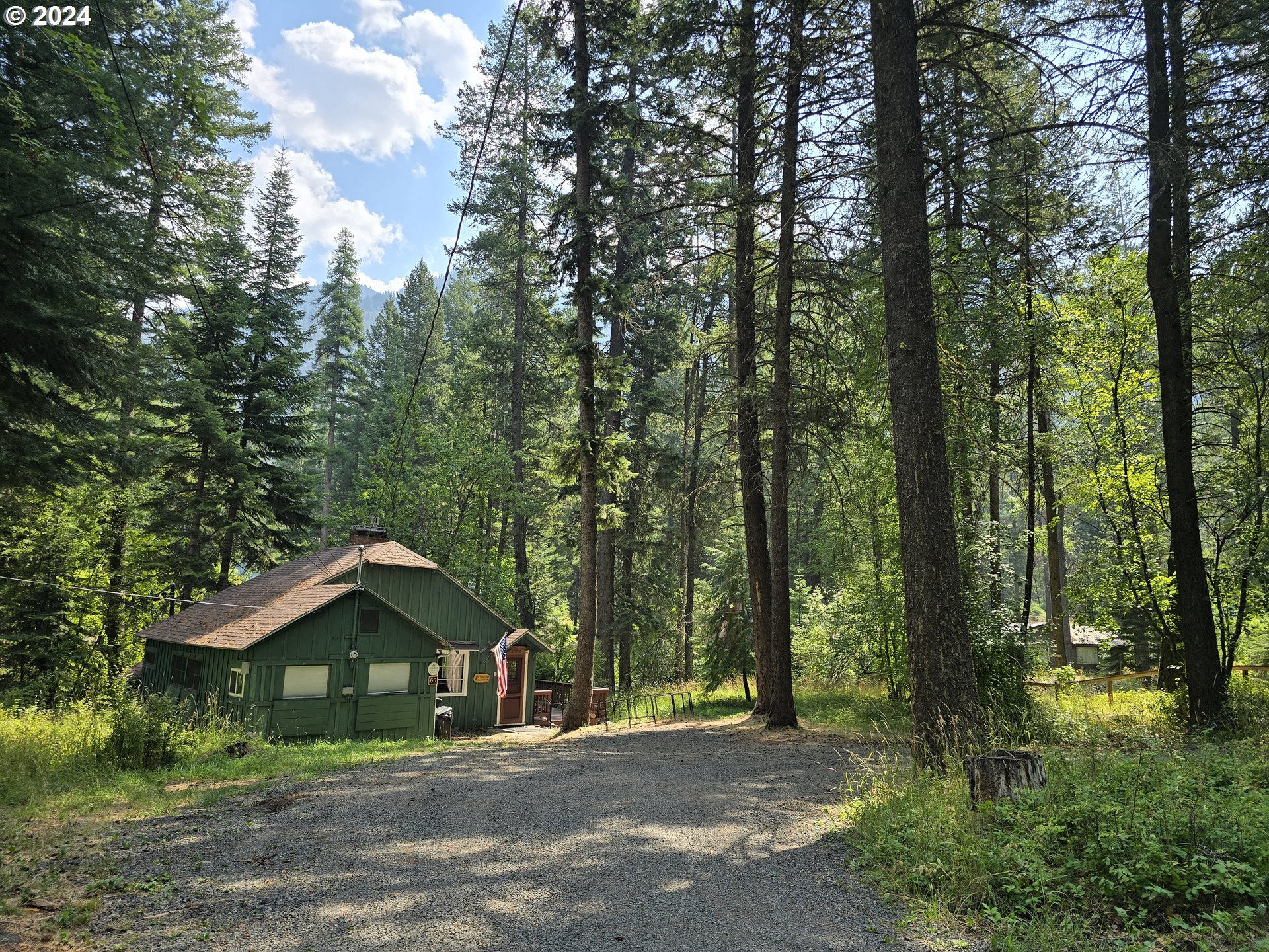 59975 Pollock Road Joseph, OR 97846 - Photo 25 of 34 a front view of a house with a garden