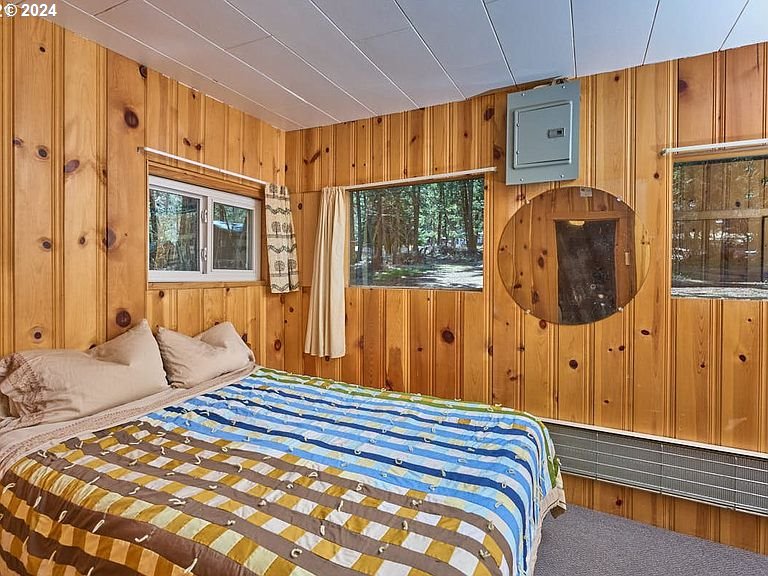 59975 Pollock Road Joseph, OR 97846 - Photo 5 of 34 a bedroom with a bed and wooden floor