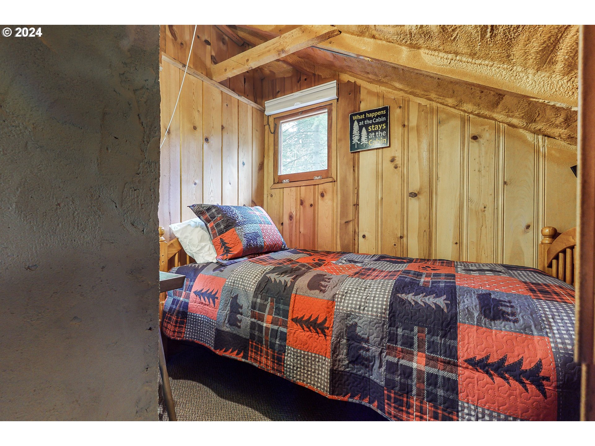59975 Pollock Road Joseph, OR 97846 - Photo 8 of 34 a bedroom with a bed next to a window