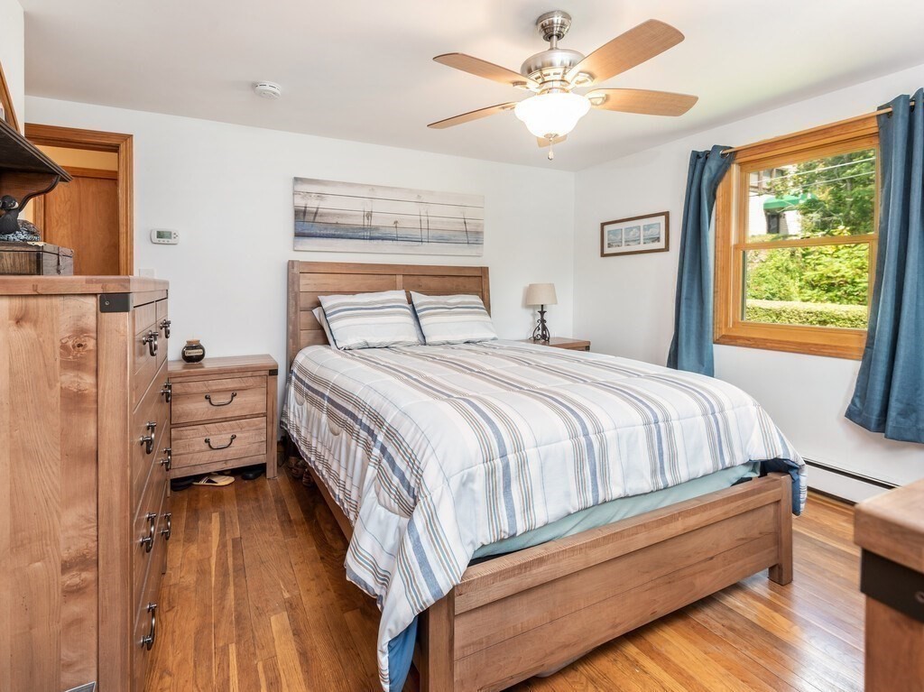 14 Killdeer Road Webster, MA 01570 - Photo 15 of 30 a bedroom with a bed and a chandelier