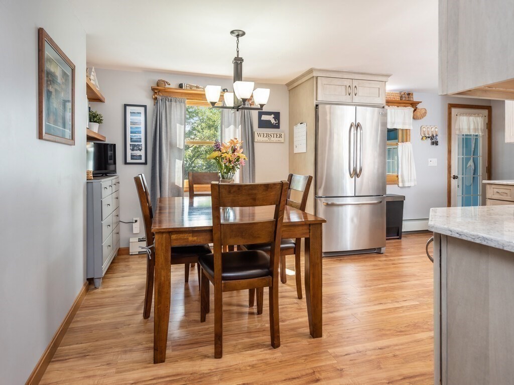 14 Killdeer Road Webster, MA 01570 - Photo 7 of 30 a dining room with furniture a chandelier and wooden floor