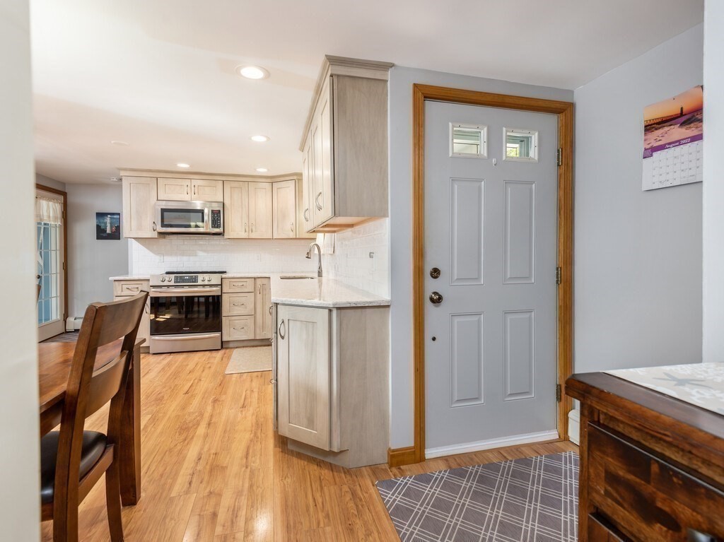 14 Killdeer Road Webster, MA 01570 - Photo 9 of 30 a kitchen with stainless steel appliances granite countertop a refrigerator and a stove top oven