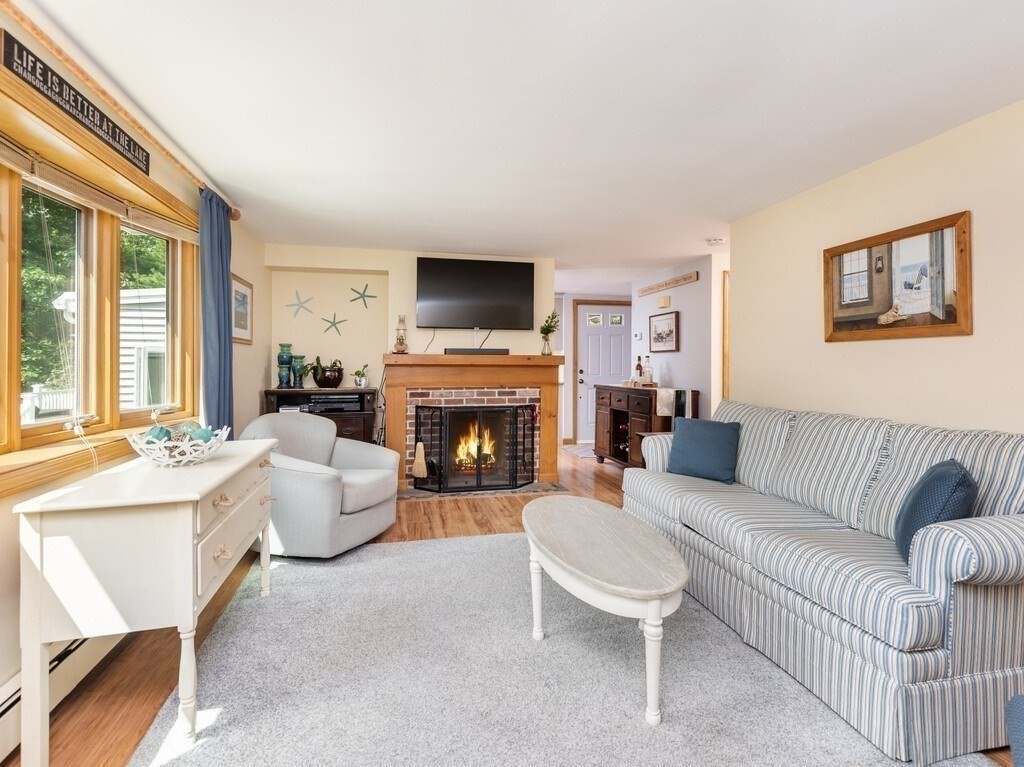 14 Killdeer Road Webster, MA 01570 - Photo 10 of 30 a living room with furniture a fireplace and a flat screen tv