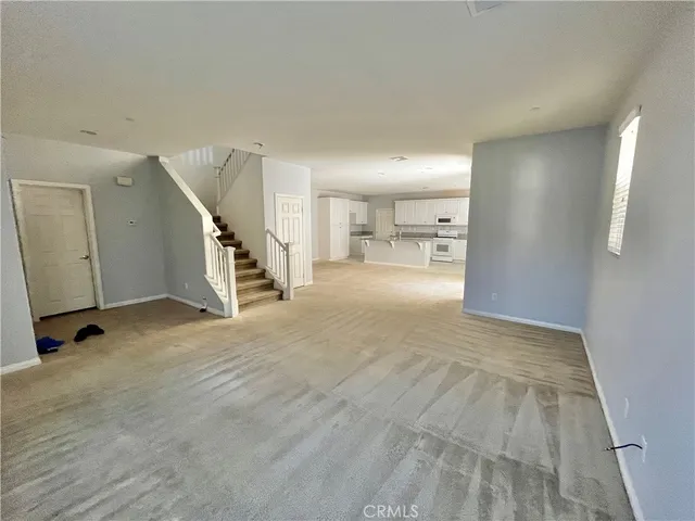 a view of a livingroom with a staircase