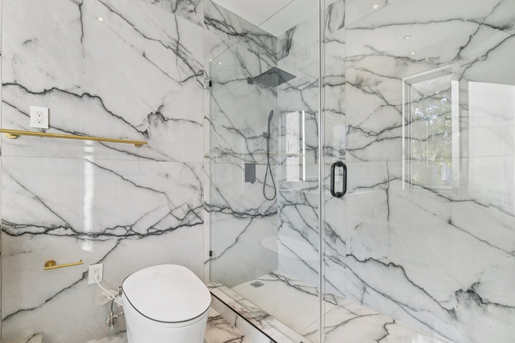 883 Greendale Avenue Needham, MA 02492 - Photo 12 of 42 a white toilet sitting next to a shower