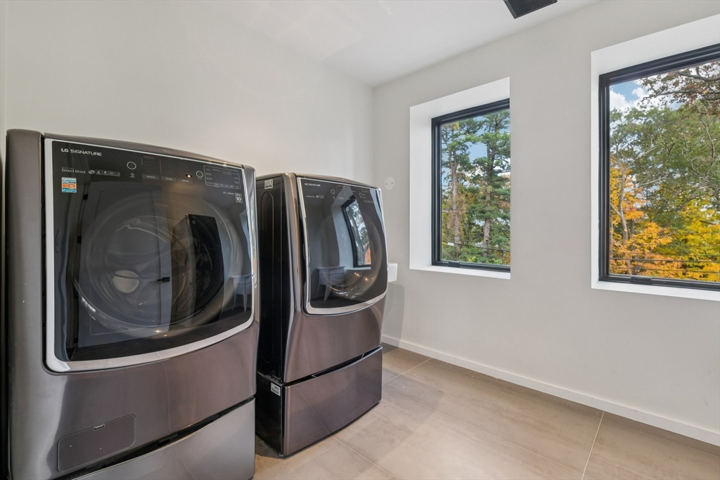 883 Greendale Avenue Needham, MA 02492 - Photo 17 of 42 a utility room with dryer and washer