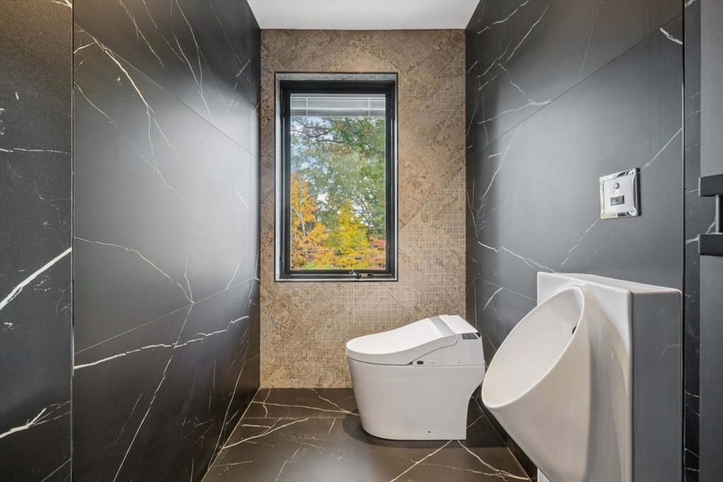 883 Greendale Avenue Needham, MA 02492 - Photo 24 of 42 a bathroom with a toilet and a sink