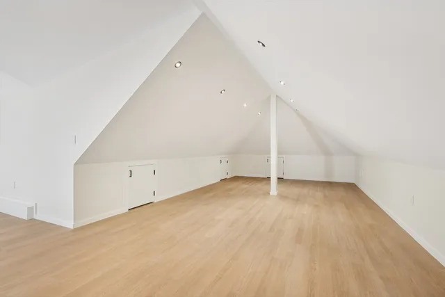 an empty room with wooden floor