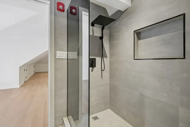 a bathroom with a shower and a sink