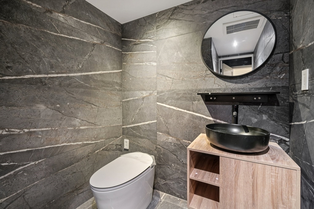 883 Greendale Avenue Needham, MA 02492 - Photo 33 of 42 a bathroom with a toilet and a sink