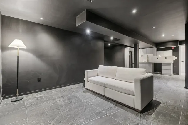 a large living room with a furniture