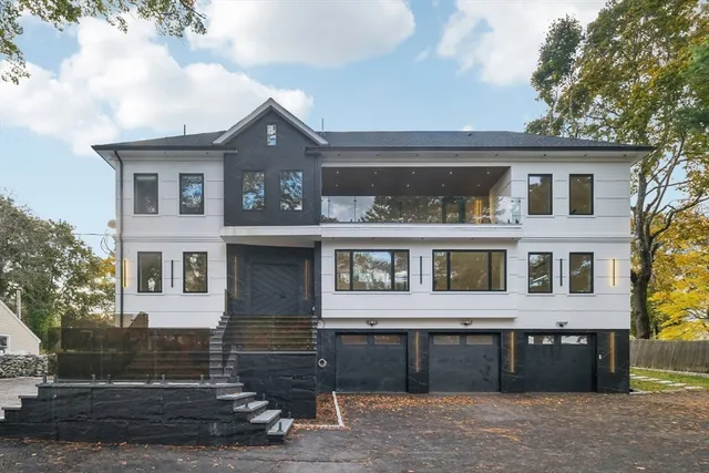 a front view of a house with a yard
