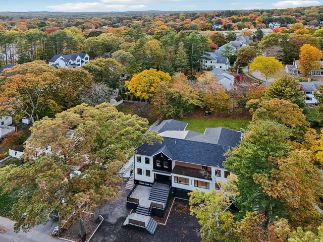 an aerial view of house with yard