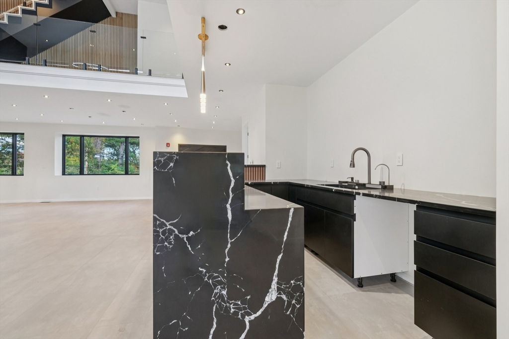 883 Greendale Avenue Needham, MA 02492 - Photo 5 of 42 a kitchen with a sink cabinets and window