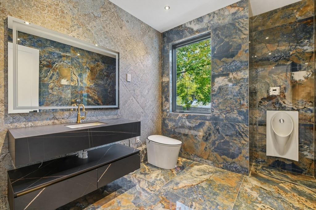 883 Greendale Avenue Needham, MA 02492 - Photo 9 of 42 a bathroom with a toilet sink and mirror