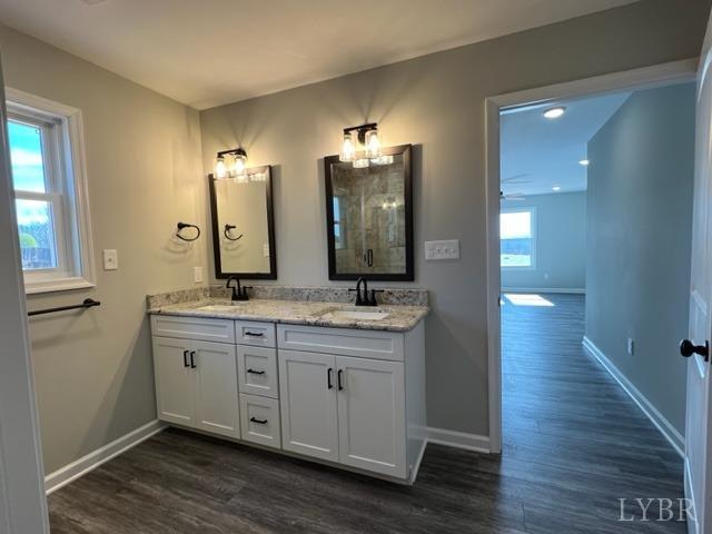 5794 Stage Road Concord, VA 24538 - Photo 12 of 32 a bathroom with a double vanity sink and a mirror