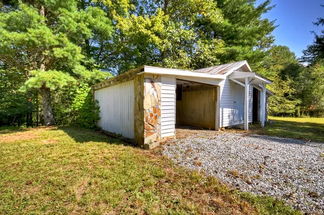 a view of a porch with furniture and floor to ceiling window
