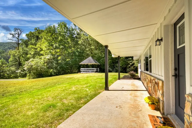 a view of a livingroom with wooden floor and window