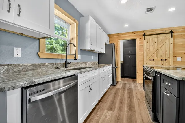 a view of kitchen with wooden floor