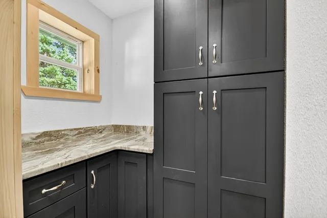 a view of a hallway with washer and dryer