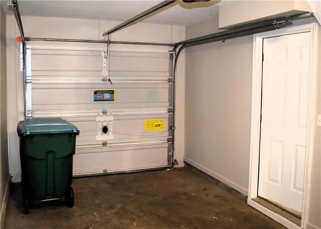 a bathroom with a bathtub and a window