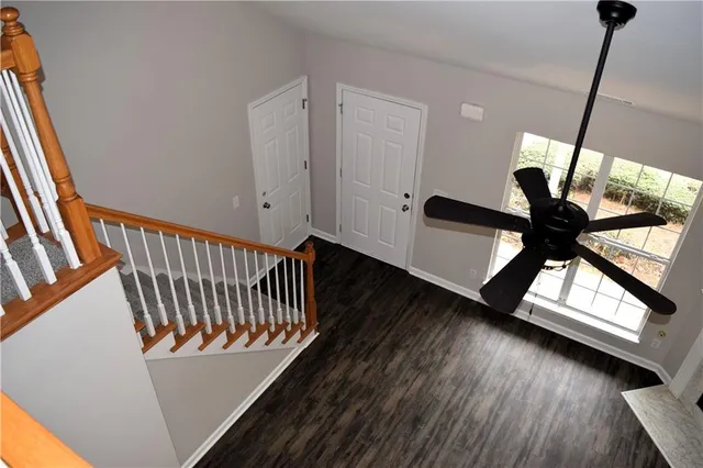 a view of an entryway with wooden floor
