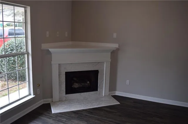 a living room with a fireplace and a fireplace