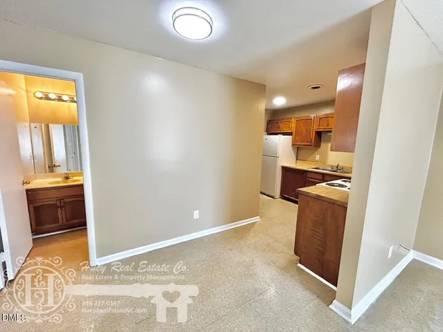 a view of a kitchen cabinets and a wooden floor
