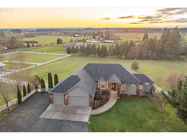 a aerial view of a house with big yard