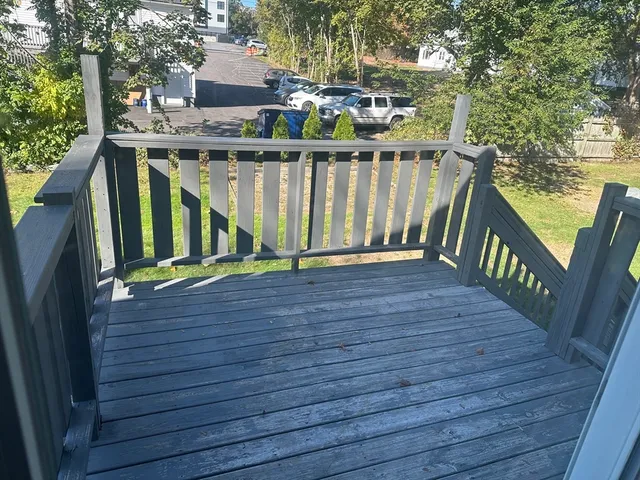 a view of a deck with a yard