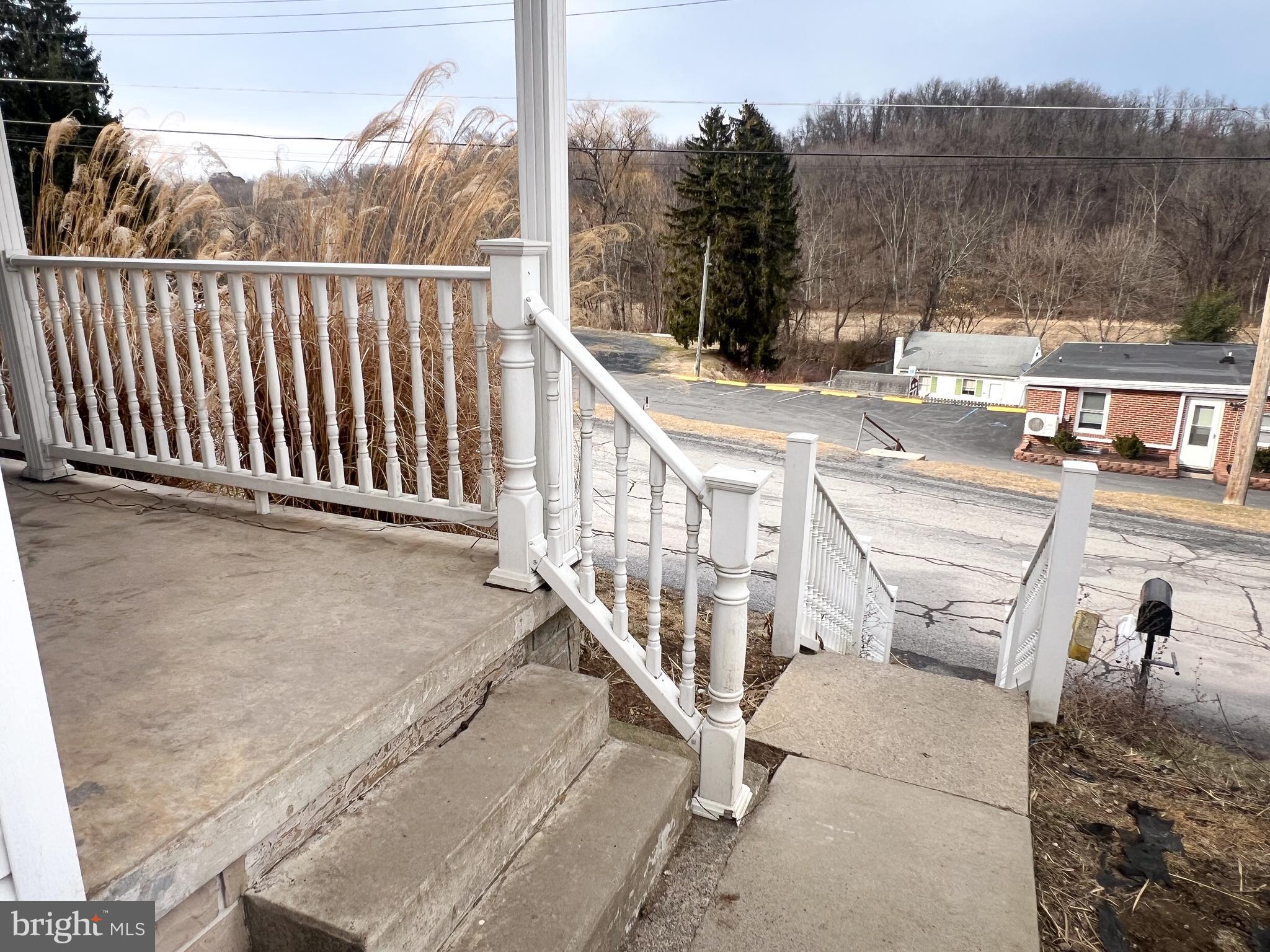 186 West Railroad Street Reedsville, PA 17084 - Photo 22 of 28 a view of a balcony with wooden floor and iron fence