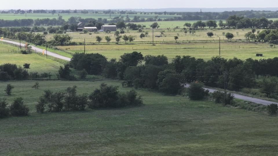 3 Hackberry Road Salado, TX 76571 - Photo 10 of 20 an aerial view of a town with residential houses and outdoor space