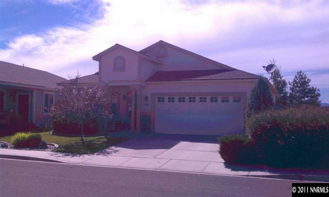 2125 Evergreen Reno, NV 89521 - Photo 1 of 1 a red sign that is sitting on the side of a road