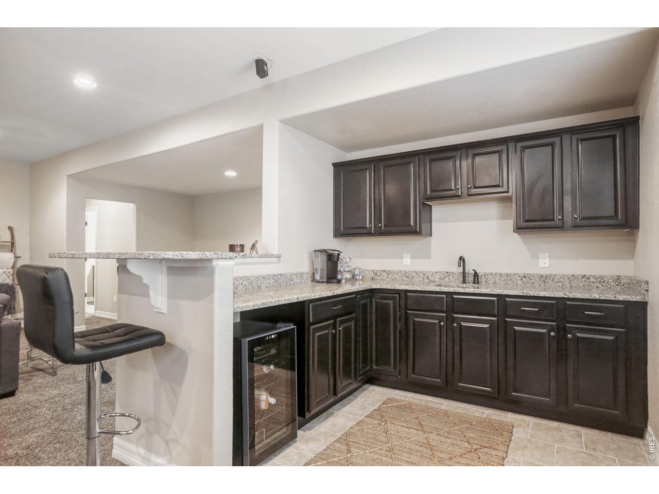 7992 St Street Frederick, CO 80530 - Photo 9 of 28 a kitchen with stainless steel appliances granite countertop a sink and cabinets