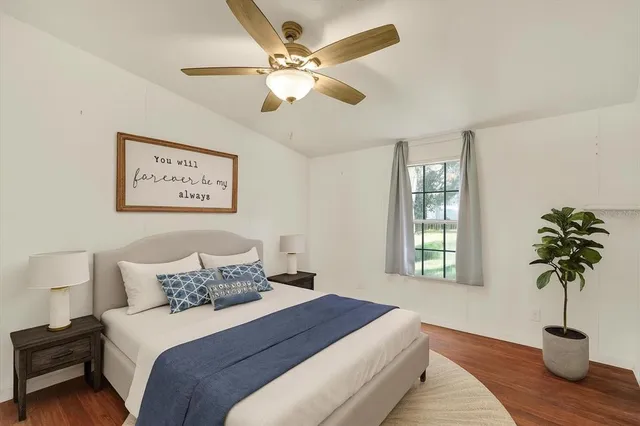 a bedroom with bed and a window